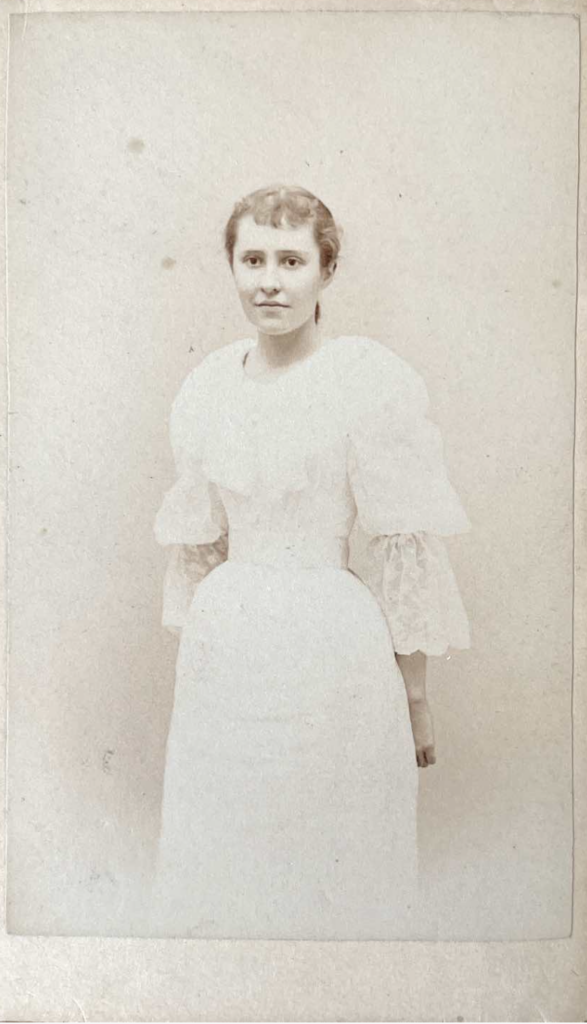 Portrait of Suzan Benedict in a white dress