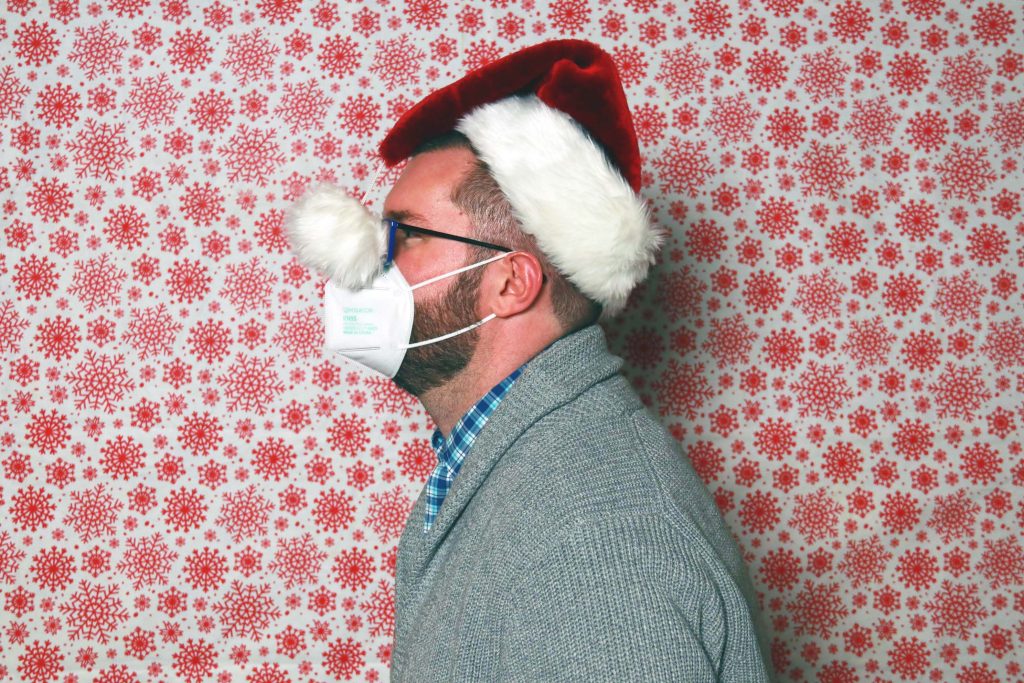 Portrait of Travis Grandy in a santa hat