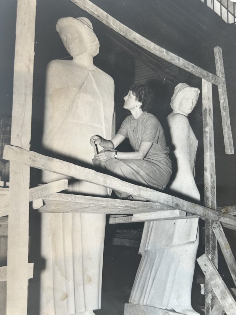 Black and white photograph of Frances working on her Army-Navy Nurse Monument and Cranbrook. 