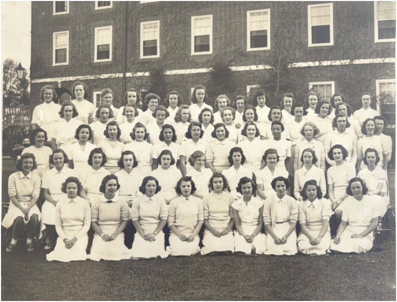 Black and white photograph of Adelaide and housemates. Taken outside 1930s.