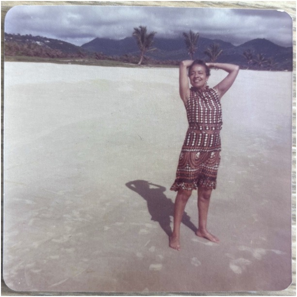Color polaroid of Adelaide Cromwell on a beach likely in Ghana, 1960s-1980s.