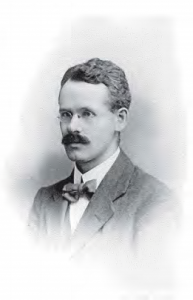 Photograph of Albert William Van Buren, a young man with a mustache and glasses