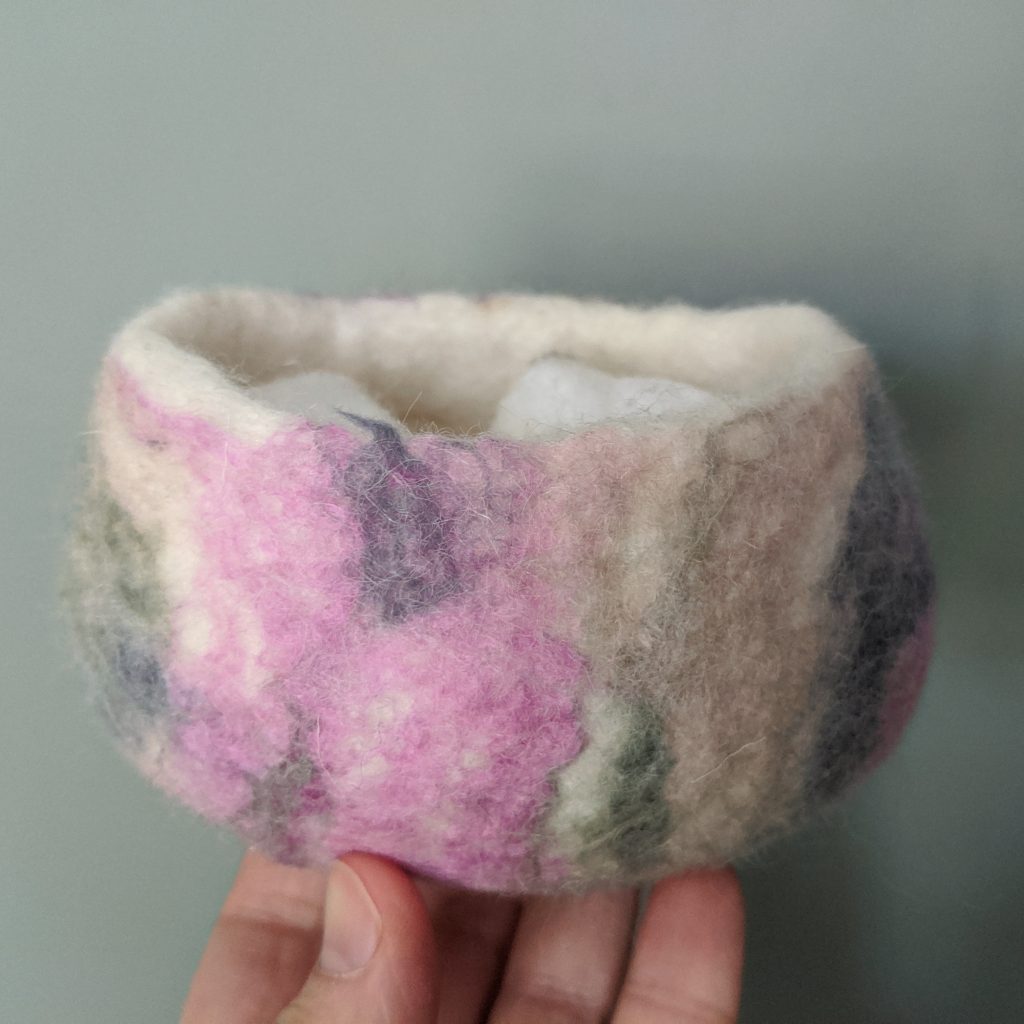pink, brown, and white felt container