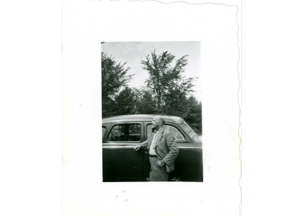 W E B Du Bois in front of a car