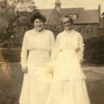 In 1912, house mothers introduced a uniform for the maids for the first time. This photo of two Morris House maids from 1919 shows a uniform of all-white, with an optional apron. A note with the photo reads: "The Morris House maids were Nora Danahy and 'Margaret.' Nora was my friend in times of stress. If I missed breakfast she never failed to come blustering along the hall complaining of those who overslept, but with her hands behind her back, holding a cup of coffee and whatever thing she could get from the kitchen." Some students formed close friendships with the maids who lived in their houses.