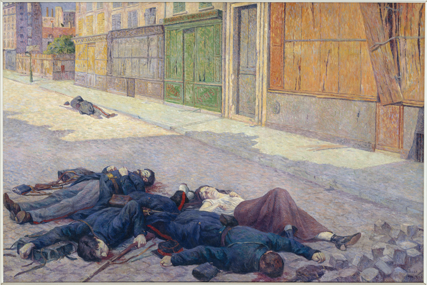 Des corps d'hommes et d'une femme gisent au sol dans une rue parisienne.