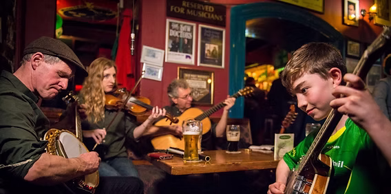 Four musicians play Irish folk music