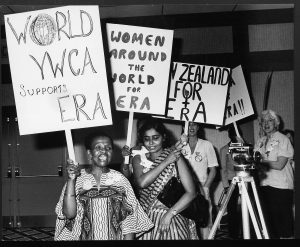 image of women marching carrying signs in support of the ERA.