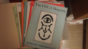 several issues of The YWCA Magazine fanned out on a table