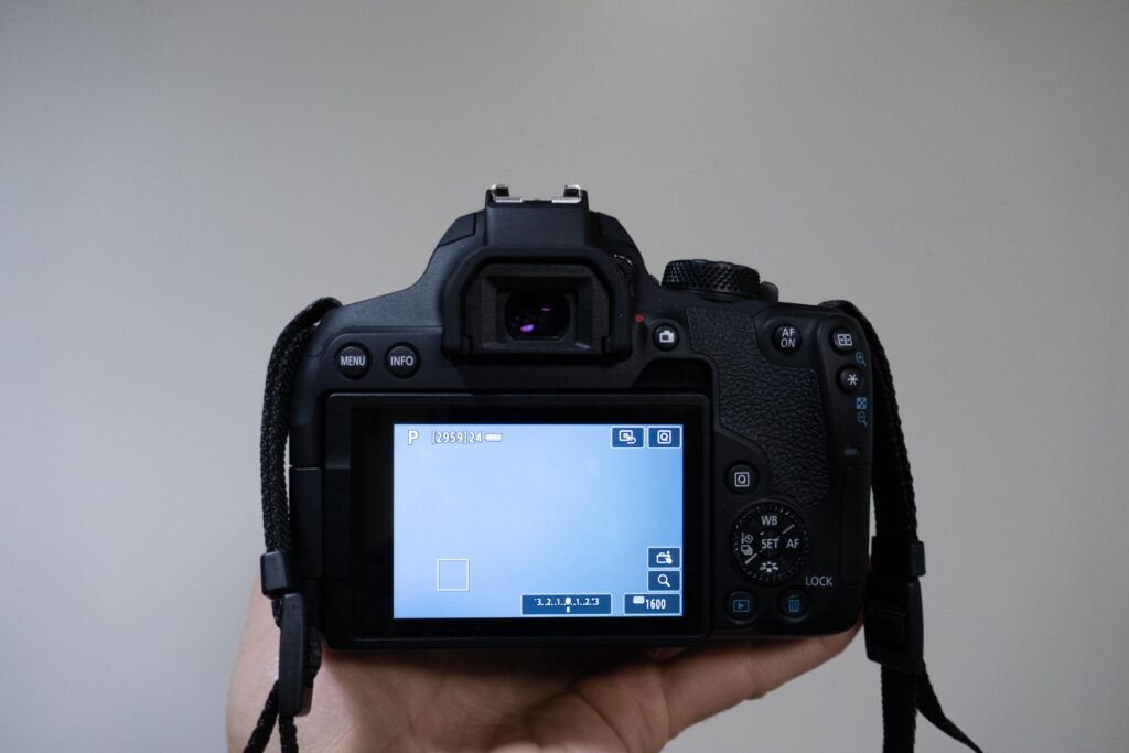 Camera taking a photo of a white wall