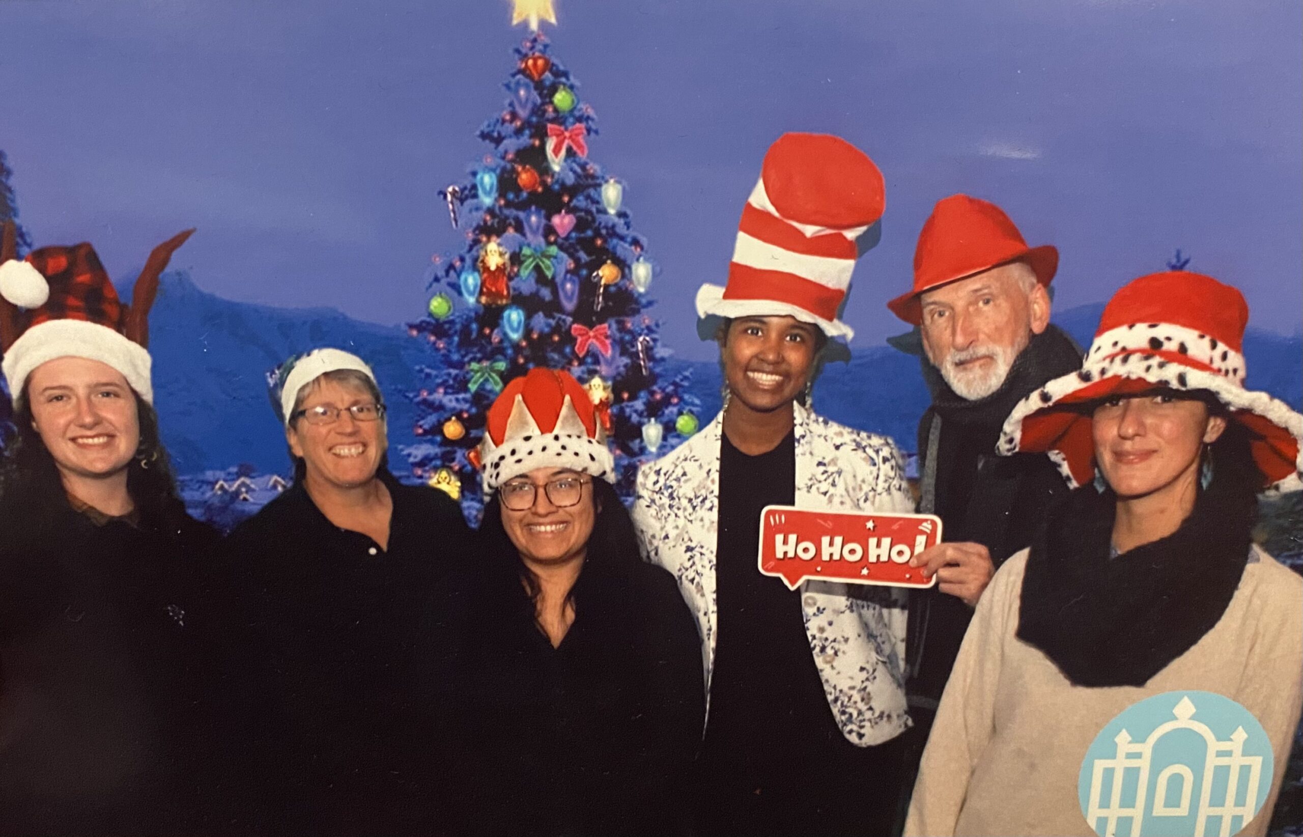 Jandon staff posing for a photo with funny hats at a holiday party