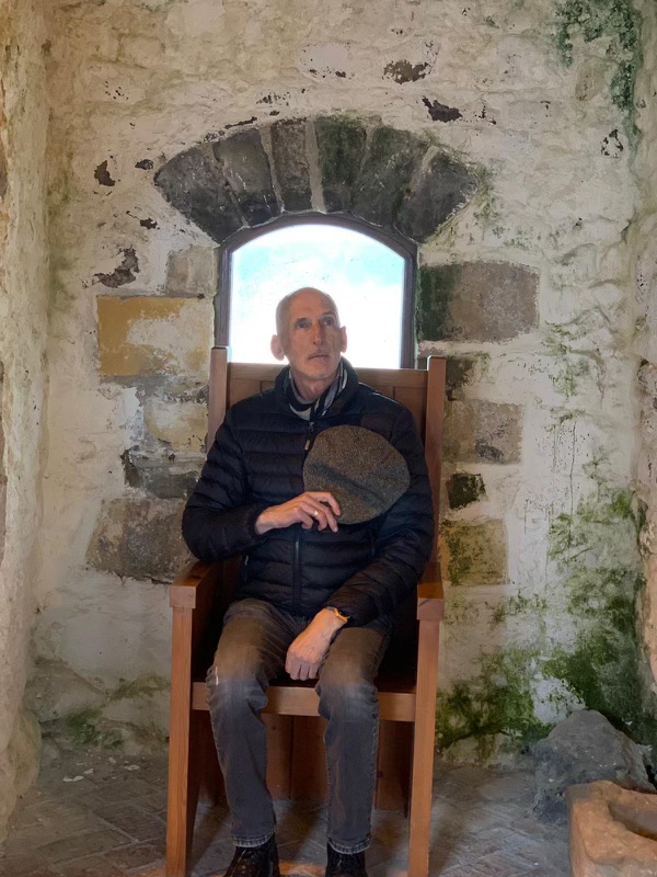 Denys posing sitting on a chair in Sandycove Ireland