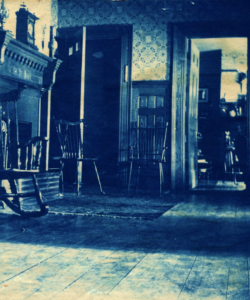 View of entryway, 1895. Mrs. Robinson's room is open on the right.