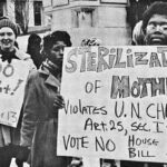 black and white photo of protesters holding a sign against sterilization