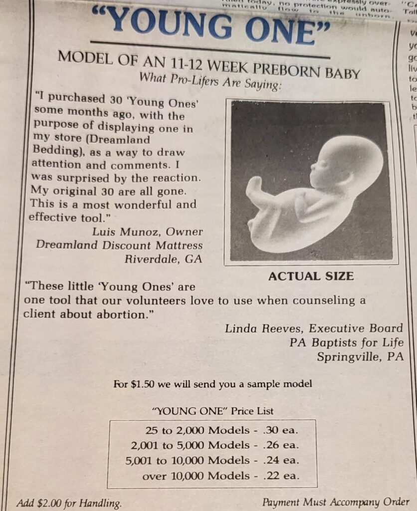Newspaper advertisement for a "model of an 11-12 week preborn baby", showing the figurine, prices, and positive reviews.