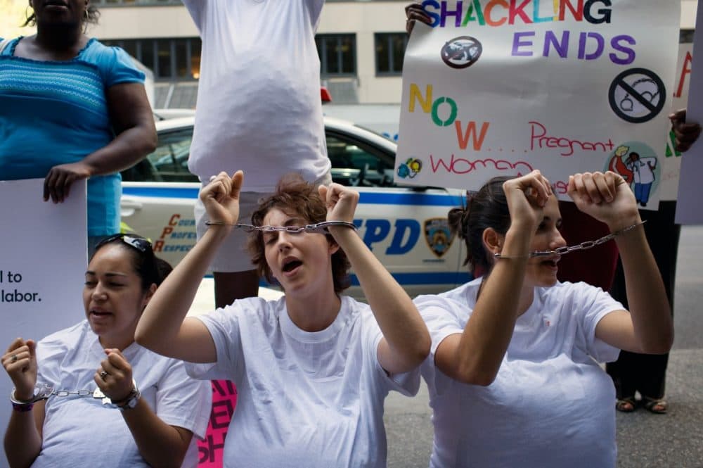 Photograph of women protesting for anti-shackling.