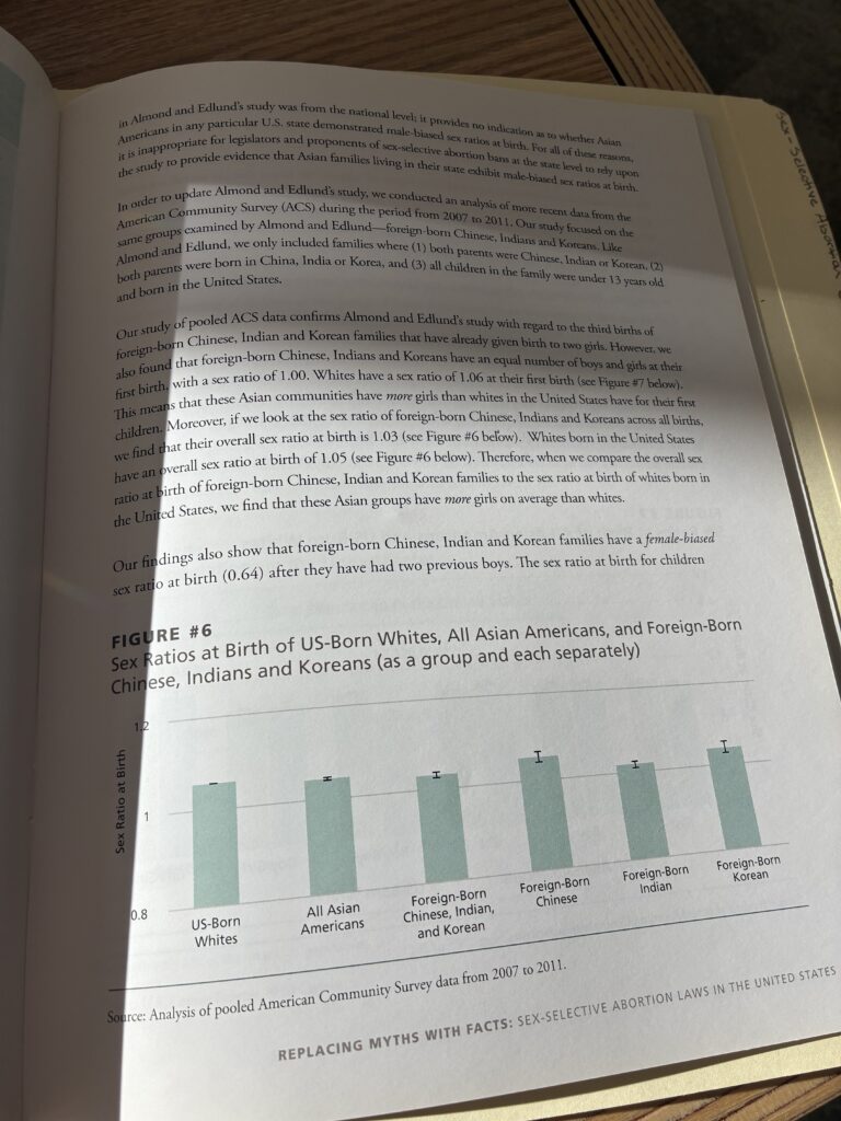 An opened booklet with sex ratio statistics