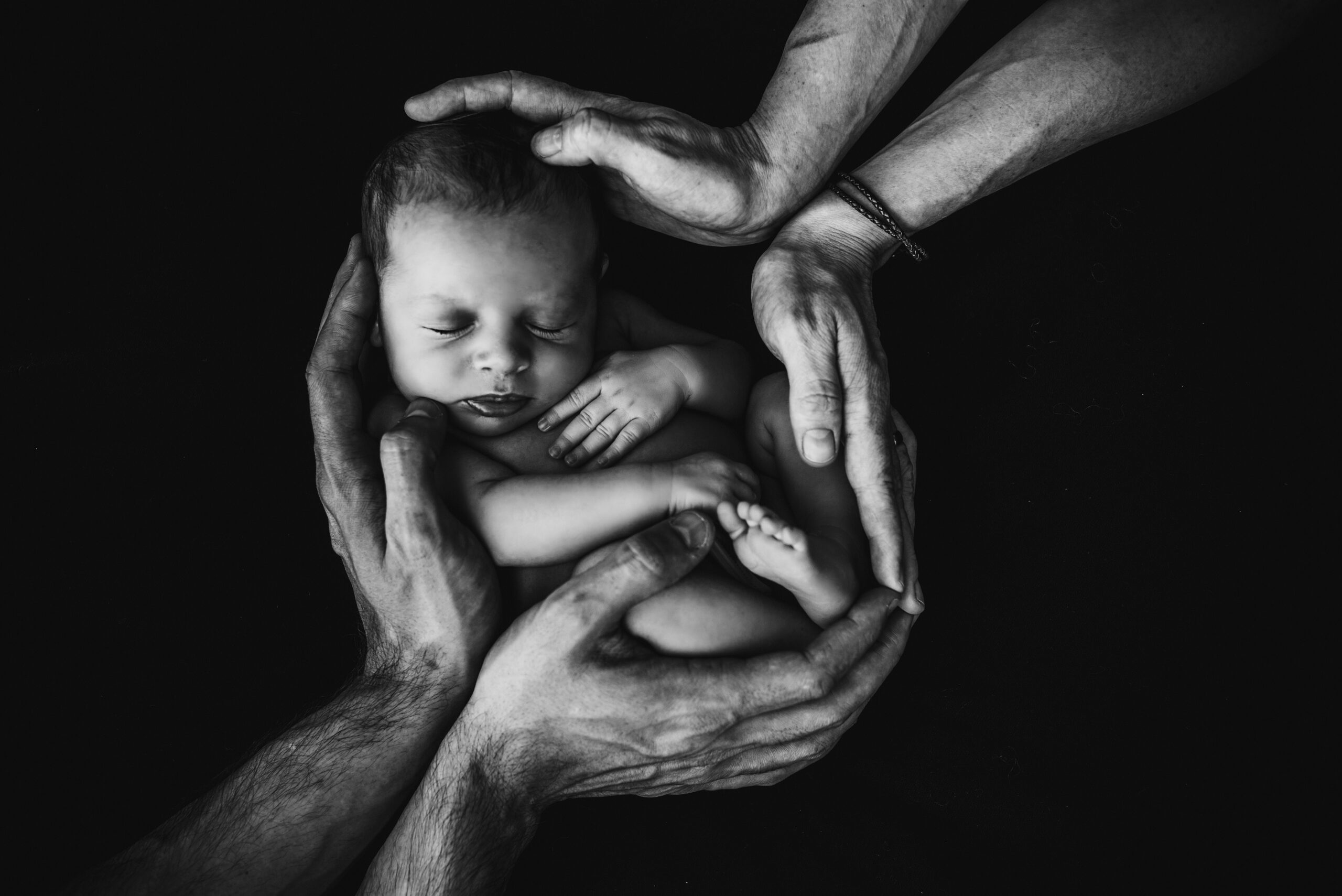 Black and white image of newborn baby