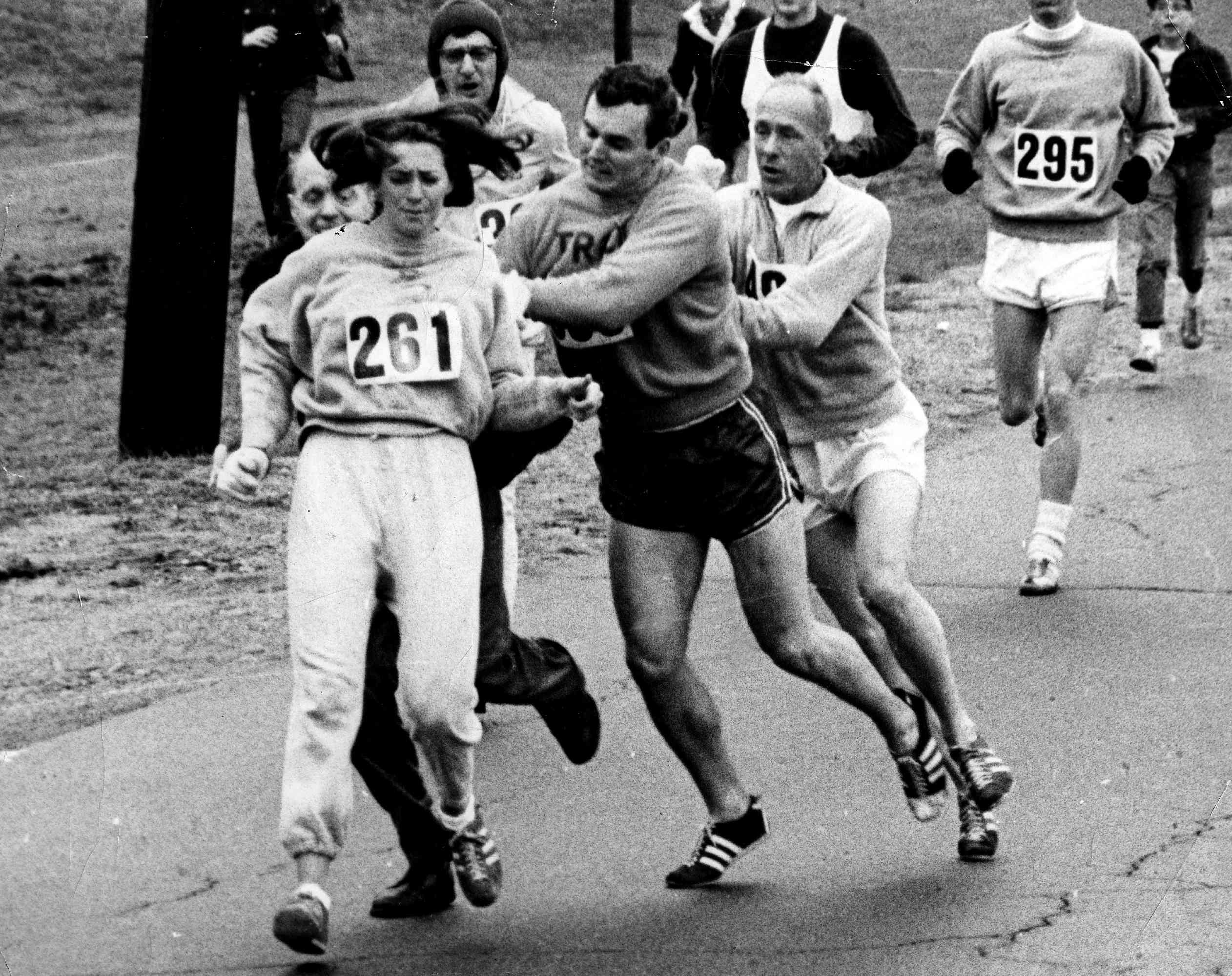 Kathrine Switzer, the first woman to enter the Boston Marathon, getting pushed out of the race by male runners.
Boston Globe via Getty Images