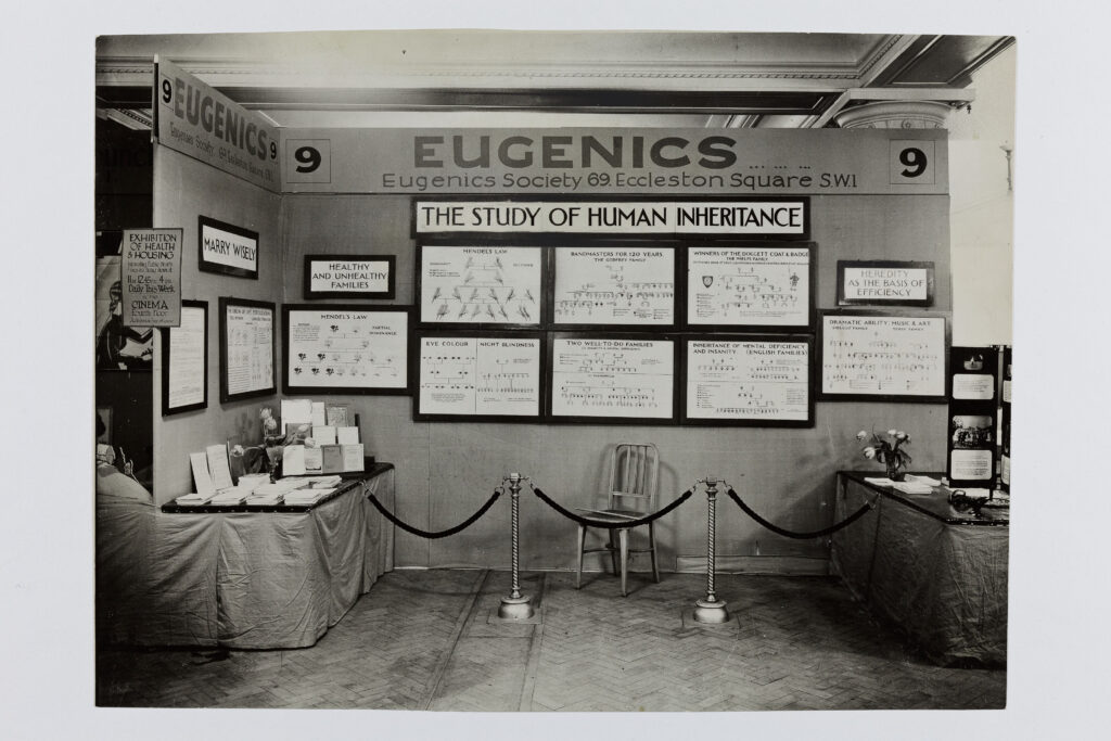 A presentation by the Eugenics Society. Family trees are displayed alongside signs reading “Healthy and Unhealthy Families” and “Marry Wisely,” among others.
Credit: Wellcome Collection