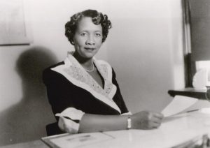 Dorothy Height sits at desk