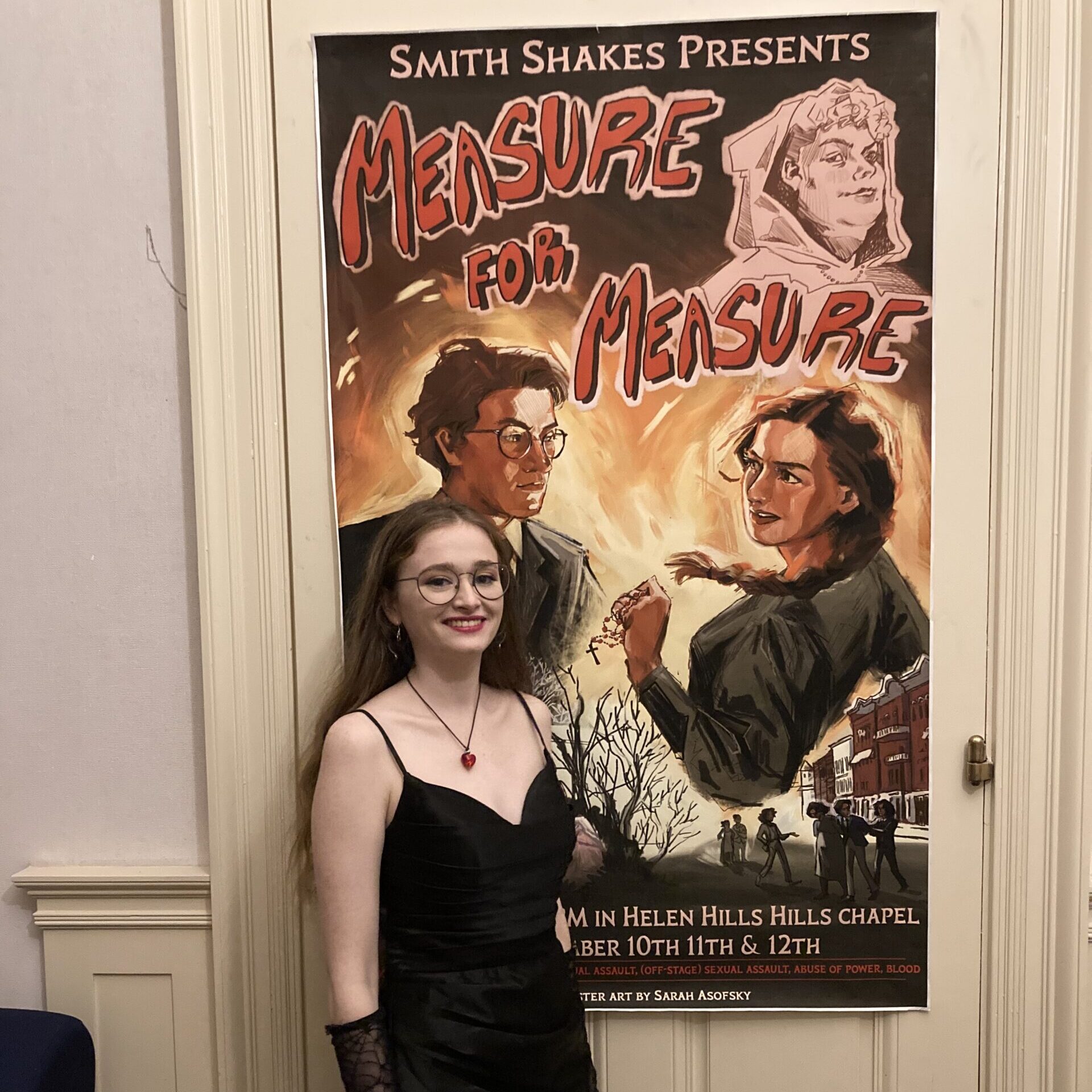 Lilith Cole '24, posing in front of a poster for her 2022 Spring Shakespeare show she directed, Measure for Measure. 