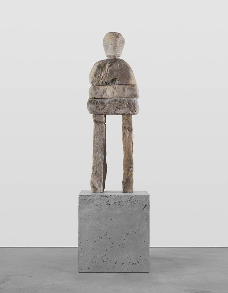 Stone humanoid statue entitled, "The Thankful"