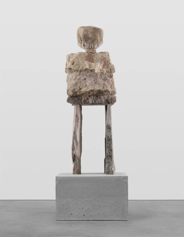 Stone humanoid statue entitled, "The Receptive"