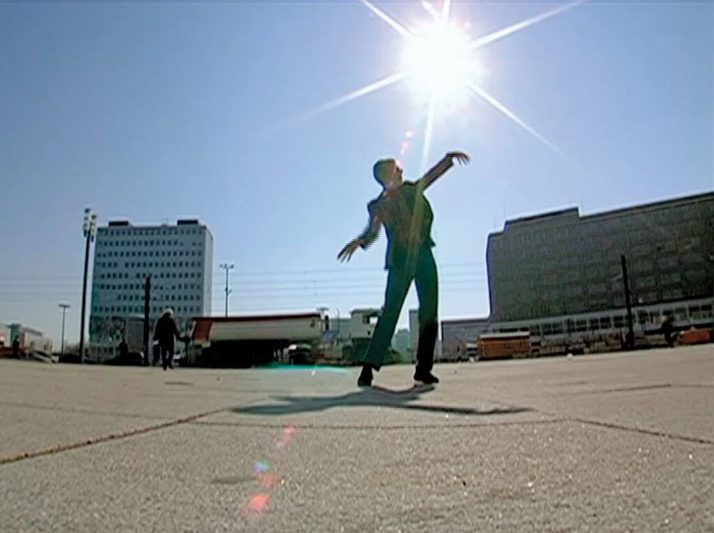 Still from video titled "Adrian Moves to Berlin" by Adrian Piper