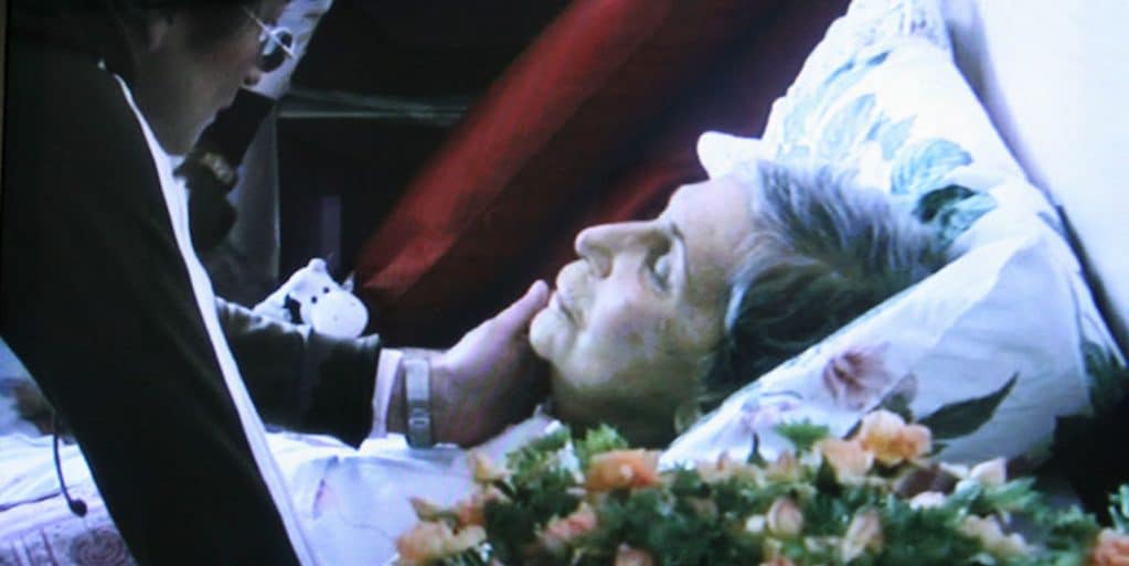 Photo still from video titled "Impossible to Catch Death" by Sophie Calle