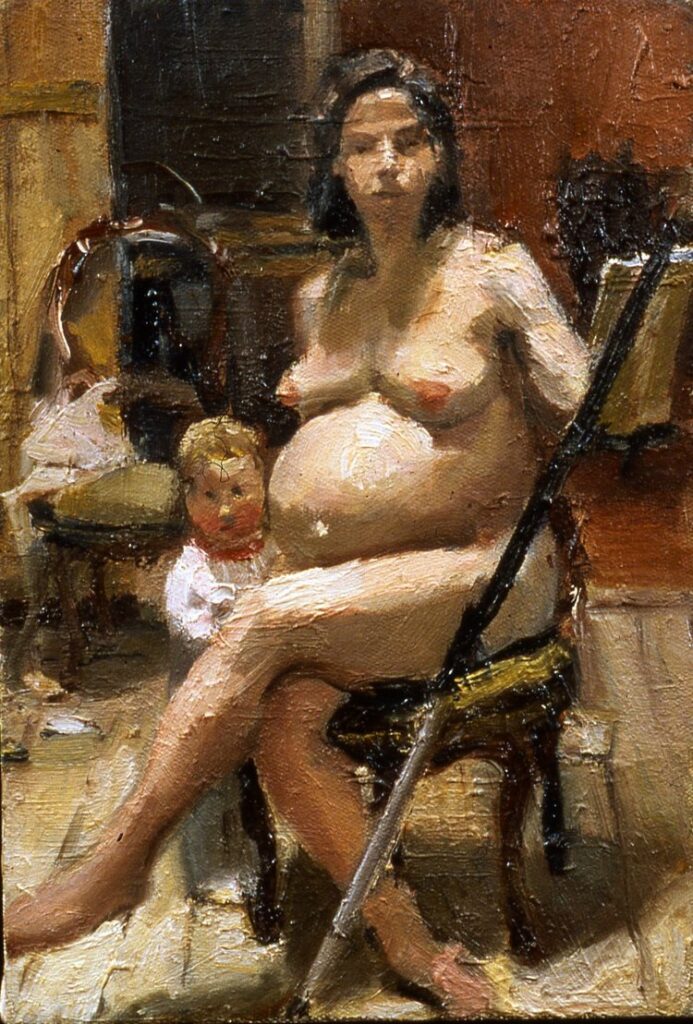 Nude, pregnant portrait of Katie Schneider at easel, looking at viewer, with a child