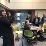 MUX Concentrators listen to Jessica Nicoll's post-capstone speech.