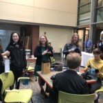 Concentrators open their MUX mugs as a keepsake of their studies.