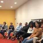 Some MUX students listen to Frank Mitchell talk for a Museums Today event.