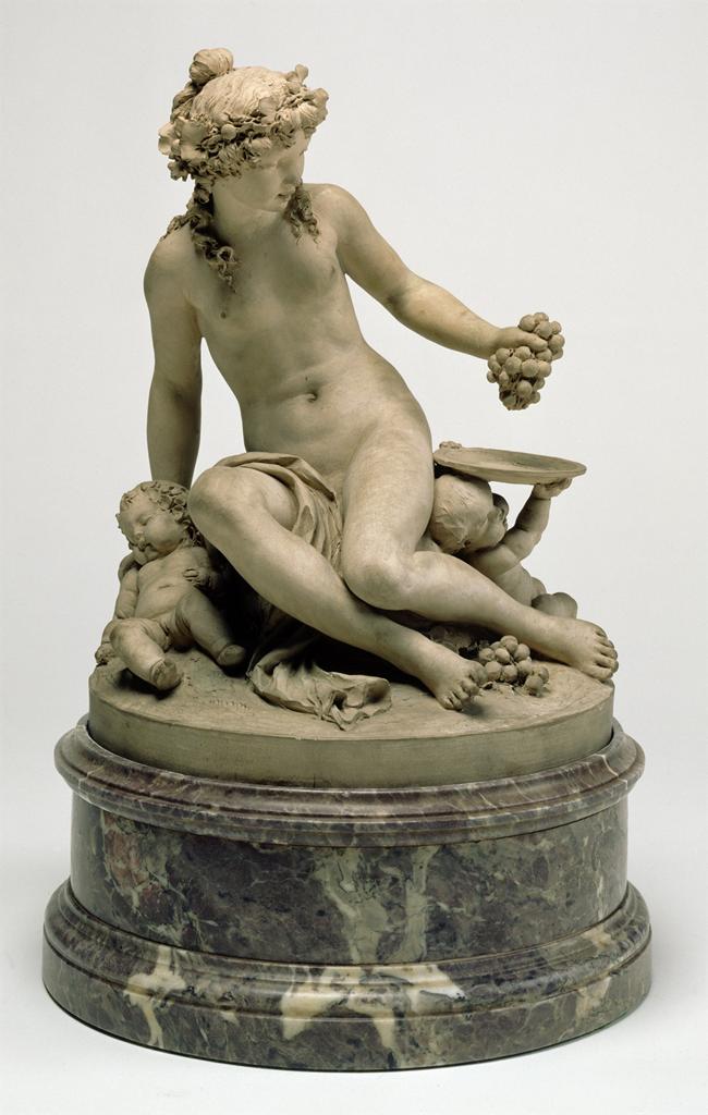 A sculpture of a Greek nymph with two children.