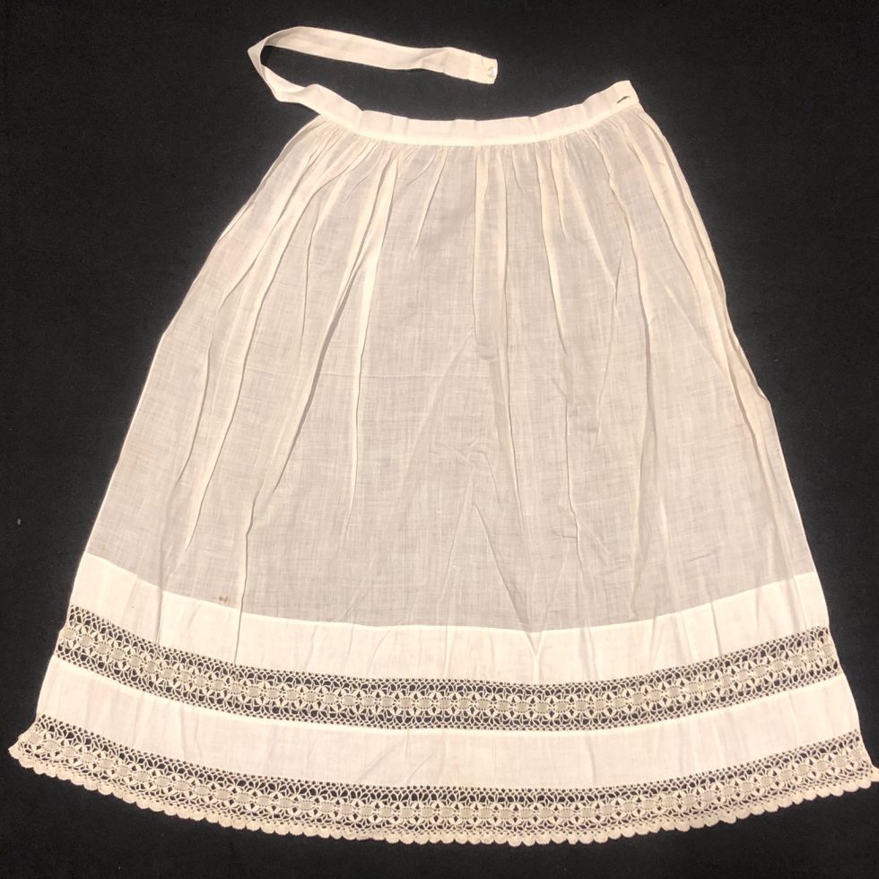 White Apron with lace detail.