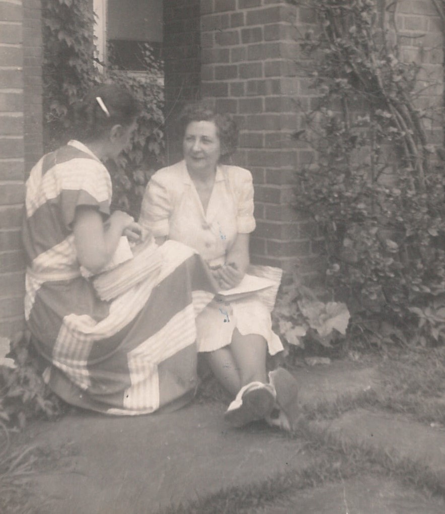 Black and white photo of two women sitting