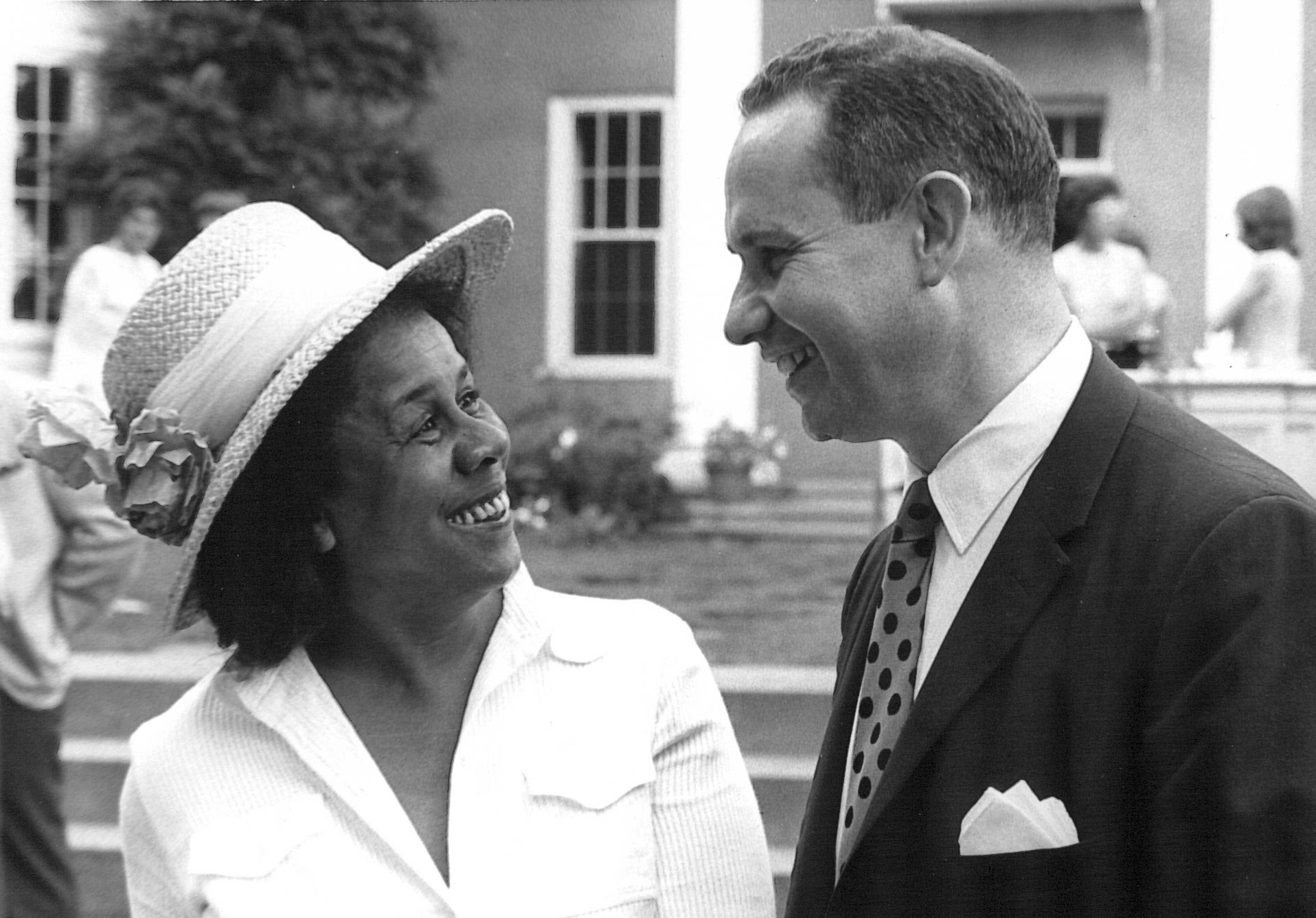 Black and white photo of Marie Singer and Howard Parad speaking