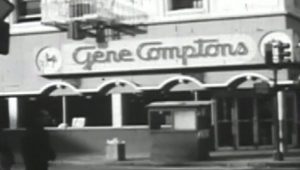 Black and white photo of a restaurant from the street, sign reads: "Gene Compton's"