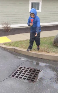 boy with storm drain