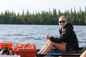 Author sitting in a canoe.