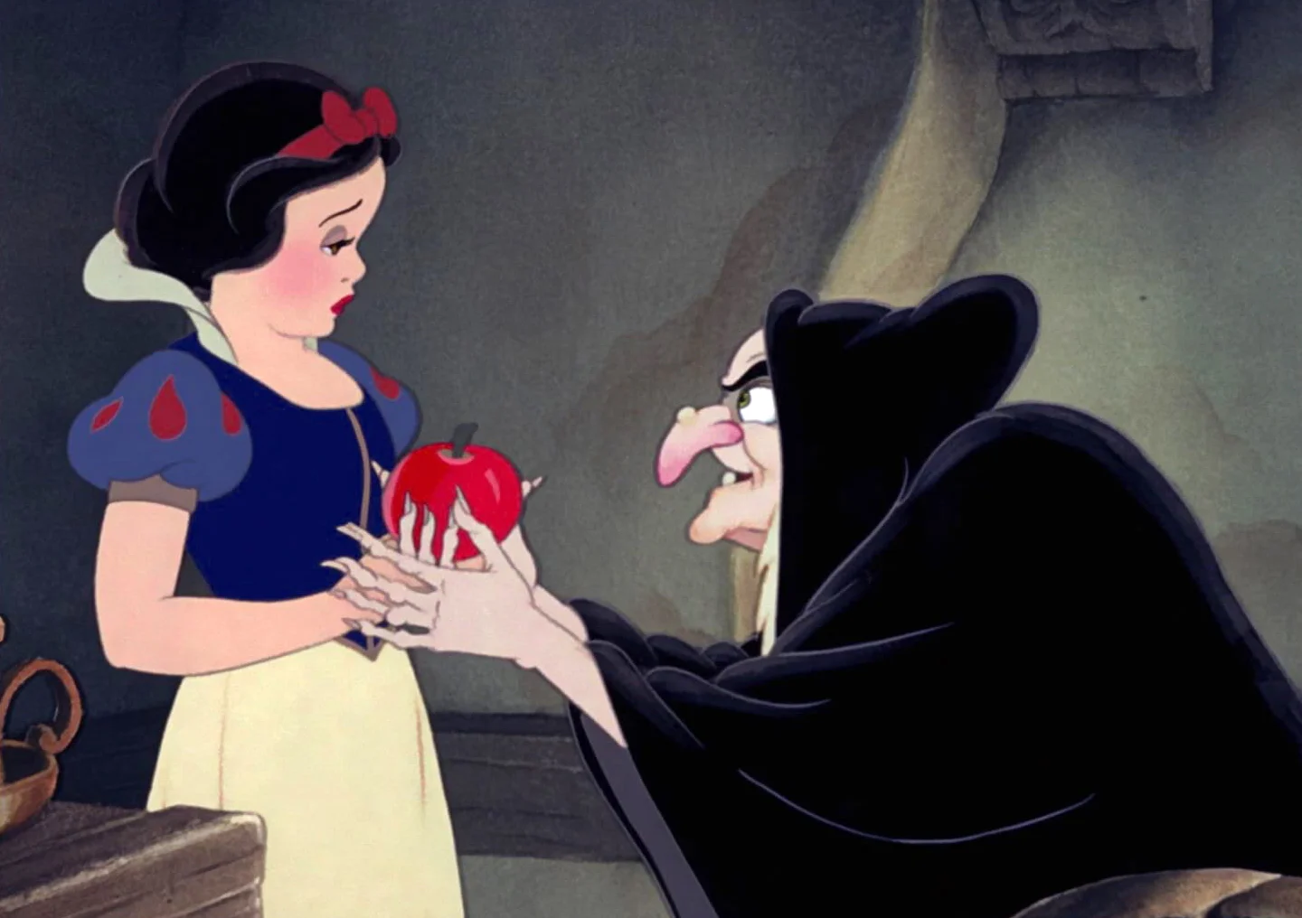 Snow white being offered apple by evil queen
